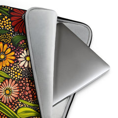 Detail view of laptop sleeve Flourishing Earth by Drese Art — earthy tones with cultural patterns
