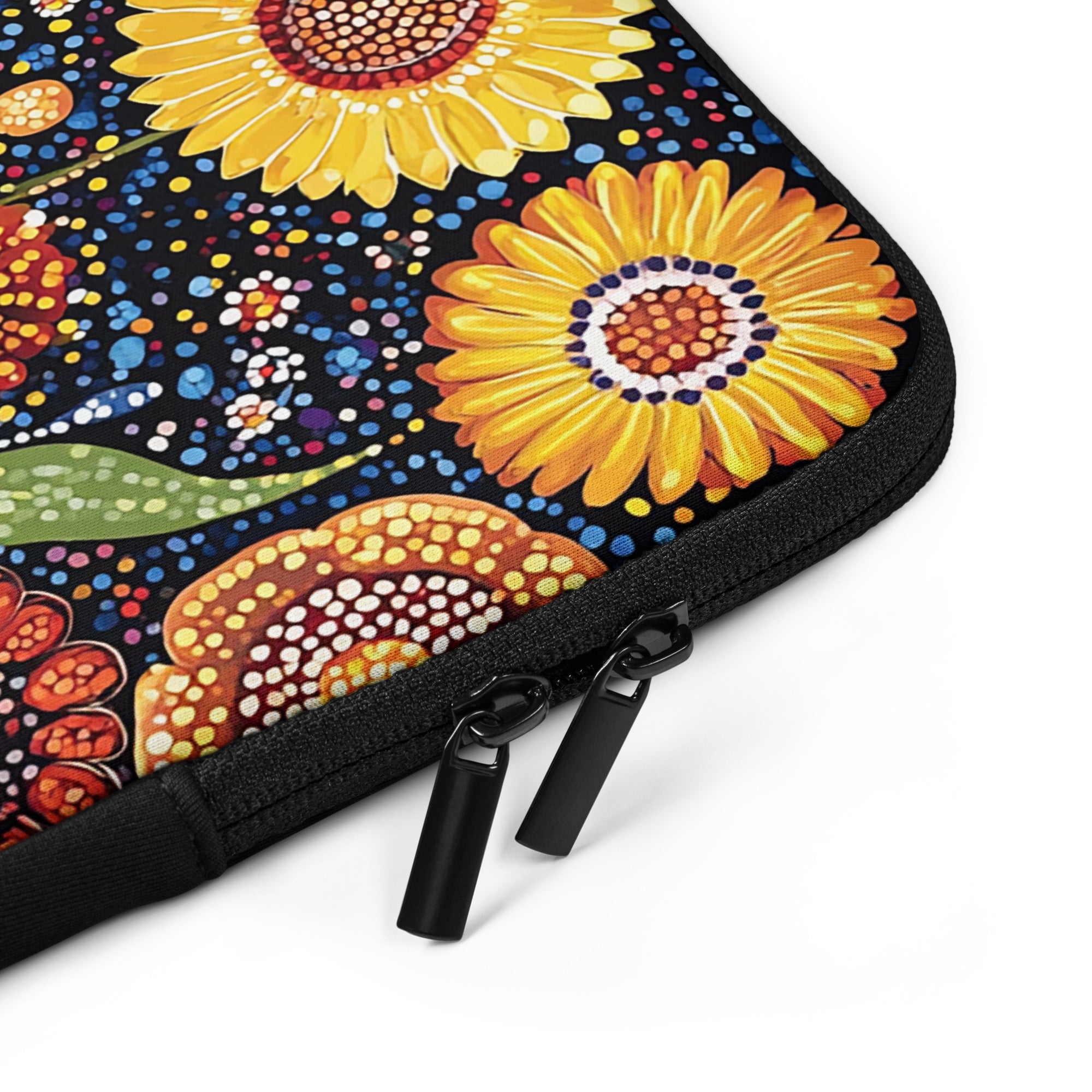 Closeup of laptop sleeve Sunlit Dreaming by Drese Art — warm Indigenous floral pattern.