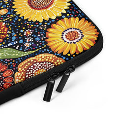 Closeup of laptop sleeve Sunlit Dreaming by Drese Art — warm Indigenous floral pattern.
