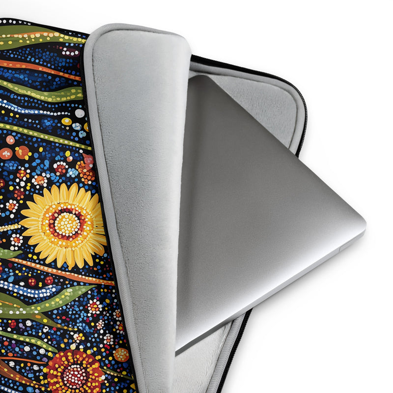 Detail view of laptop sleeve Sunlit Dreaming by Drese Art — warm Indigenous floral pattern